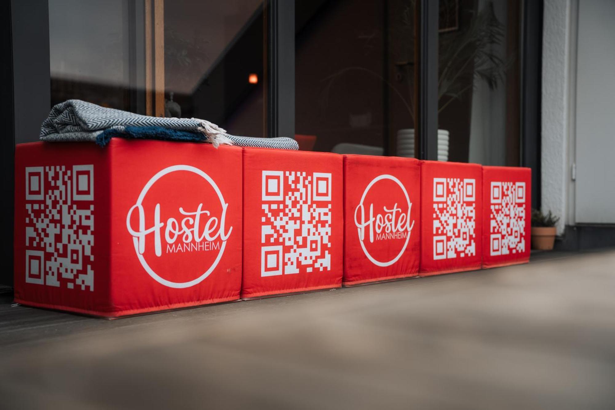 Hostel Mannheim Exterior photo QR codes on a bench
